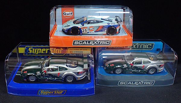 THREE BOXED SCLAEXTRIC CARS