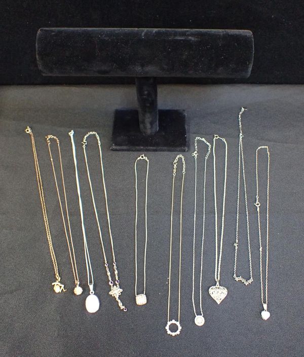 TEN MARKED SILVER PENDANTS AND CHAINS