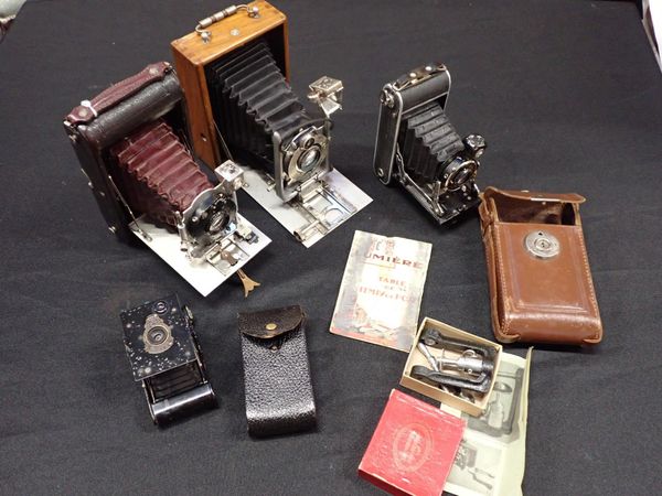 FOUR VINTAGE FOLDING BELLOWS CAMERAS: