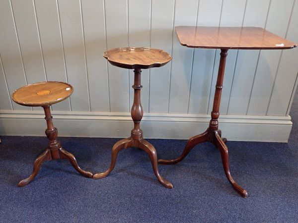 A MAHOGANY KETTLE STAND WITH DISHED TOP