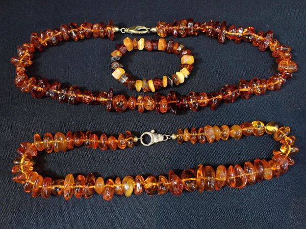 TWO AMBER NECKLACES