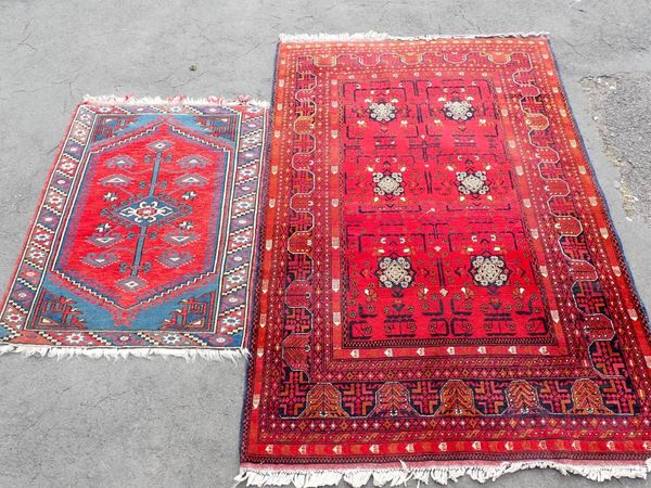 A RED GROUND RUG