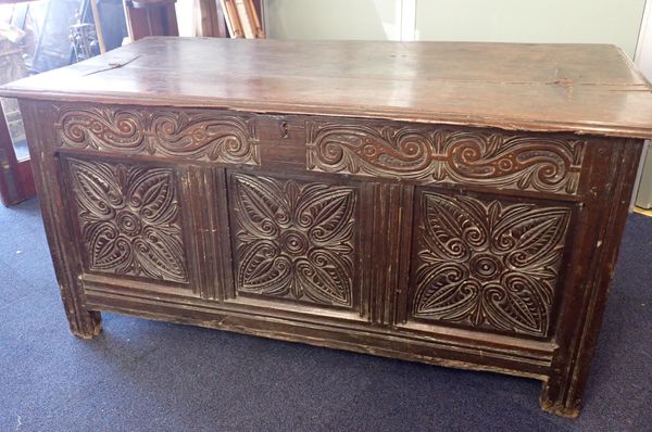 A 17th CENTURY OAK COFFER WITH CARVED FRONT