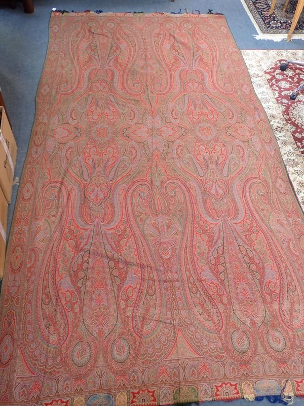 AN ANTIQUE WOOLLEN PAISLEY 'CRINOLINE' SHAWL