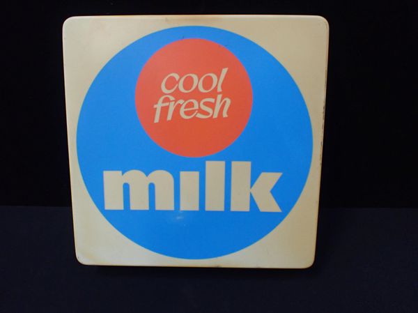 A 'COOL FRESH MILK' SIGN