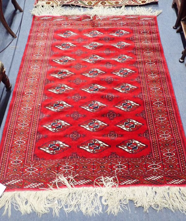 A RED GROUND TURKMEN STYLE RUG