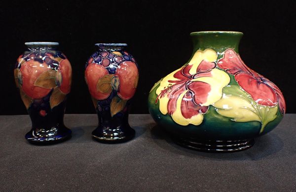 MOORCROFT: A PAIR OF SMALL POMEGRANATE VASES