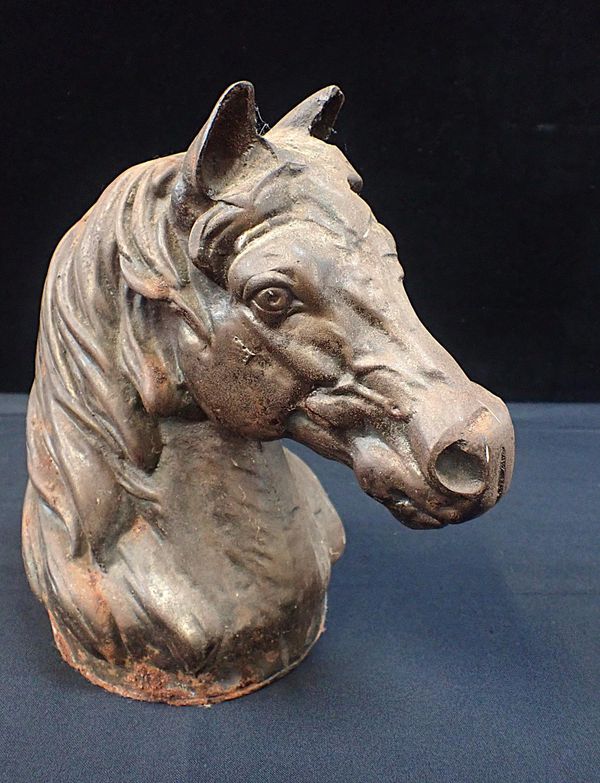 A CAST IRON HORSES HEAD