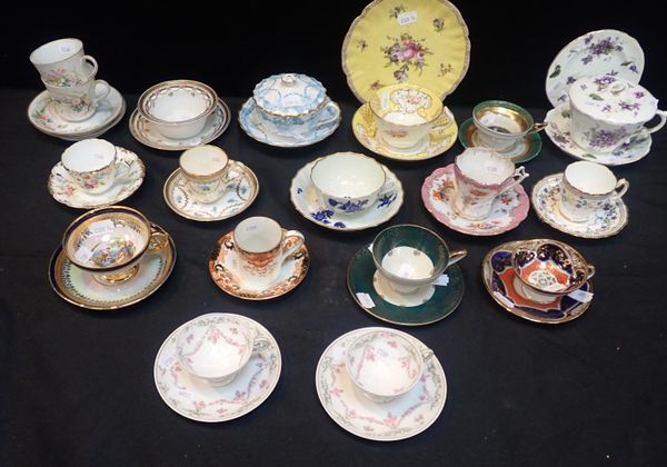 A COLLECTION OF  DECORATIVE CABINET CUPS AND SAUCERS