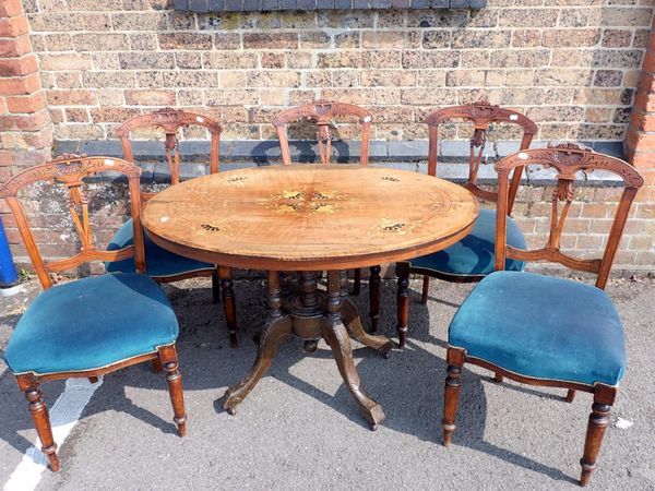 A VICTORIAN WALNUT OVAL TABLE WITH MARQUETRY TOP