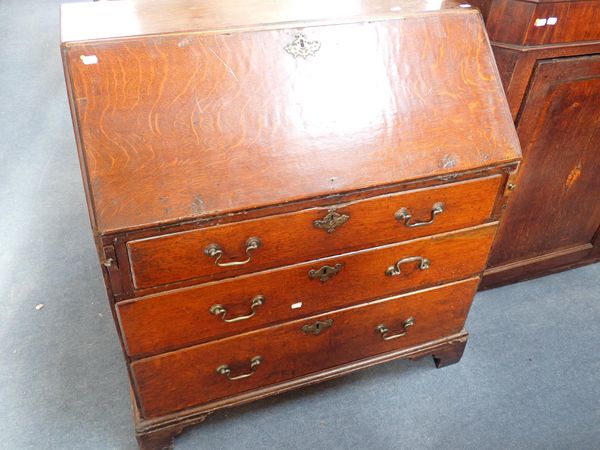 A GEORGE III OAK BUREAU