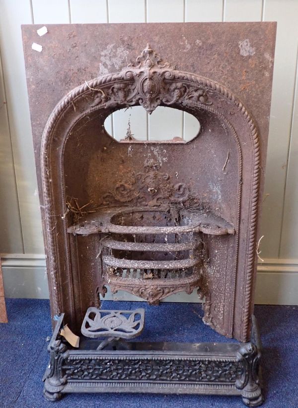 A VICTORIAN CAST IRON FIRE INSERT