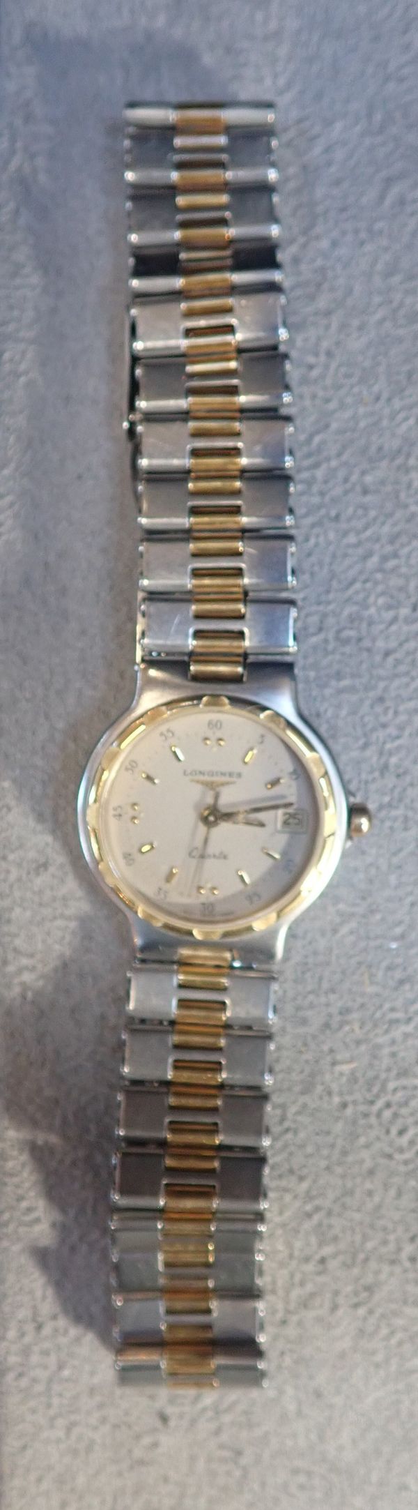 A LONGINES CONQUEST STAINLESS STEEL AND GOLD PLATED LADIES WRIST WATCH