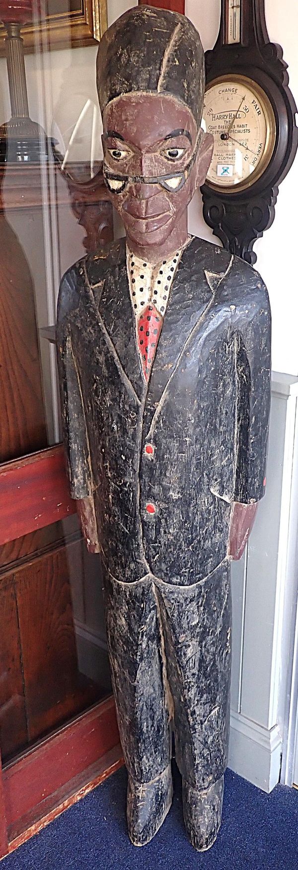 A LARGE AFRICAN CARVED WOODEN FIGURE