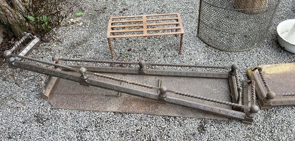 A PAIR OF EARLY 19TH CENTURY WROUGHT IRON IMPLEMENT RESTS