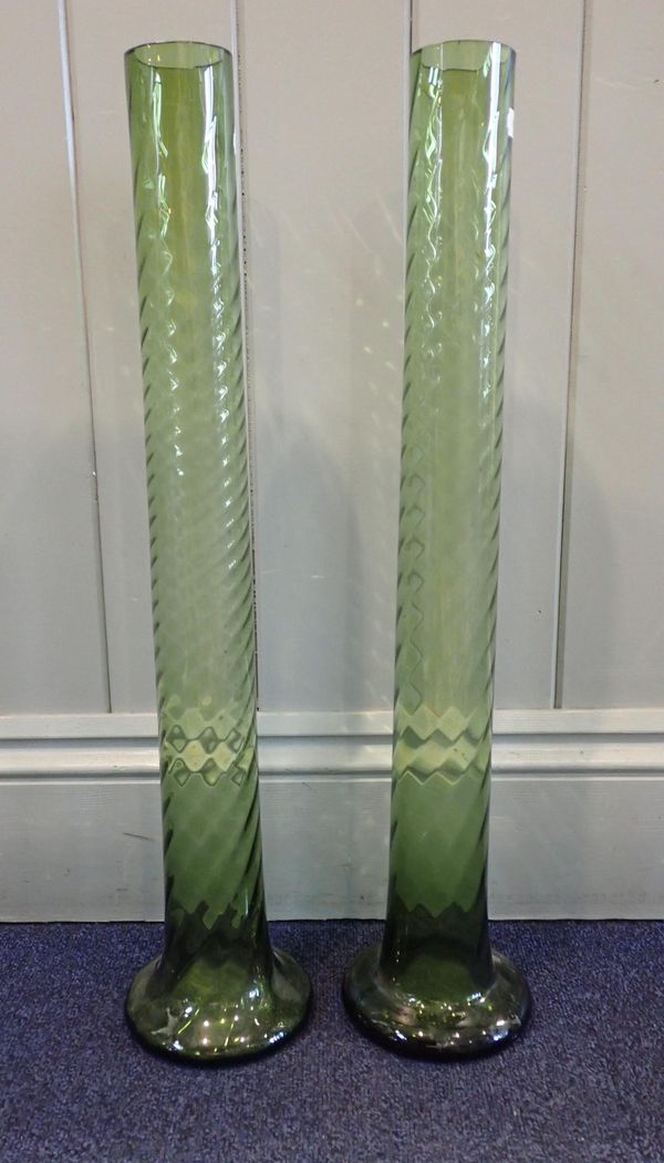 A NEAR PAIR OF TALL GREEN GLASS LILY VASES