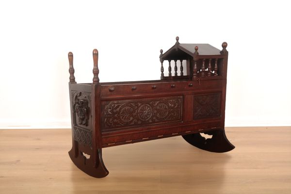 A CHILD'S OAK CRIB