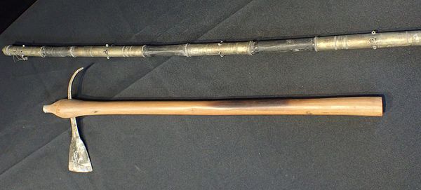 A CEREMONIAL STAFF, BRASS AND LEATHER  MOUNTED