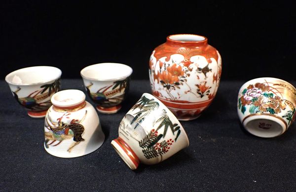 A SET OF FOUR JAPANESE CERAMIC CUPS