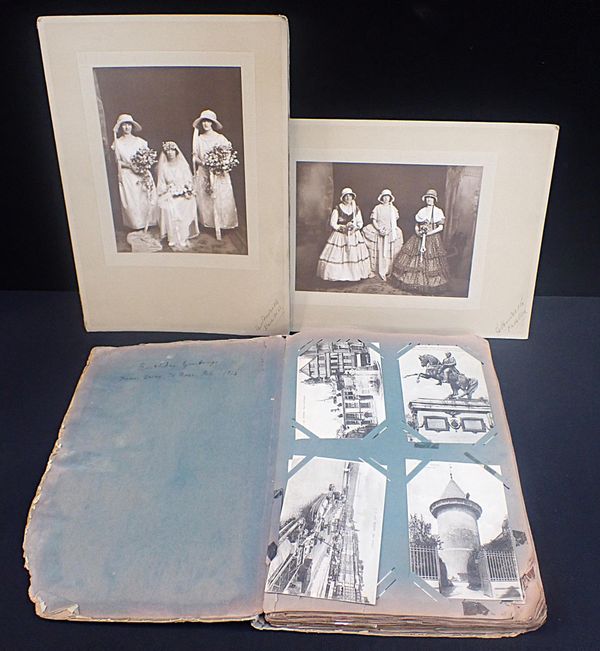 A POSTCARD ALBUM INCLUDING WWI ERA MILITARY CARDS