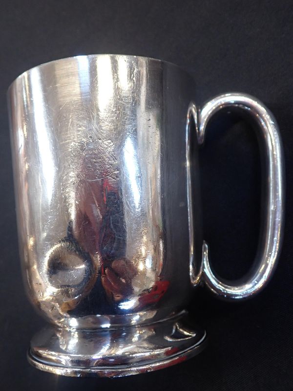 A SILVER-PLATED TANKARD FROM THE HOTEL CECIL
