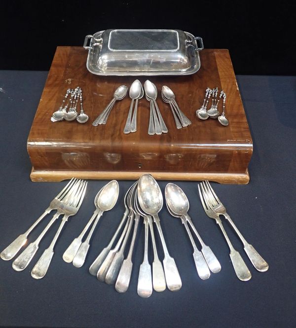 A SET OF TWELVE WHITE METAL APOSTLE SPOONS