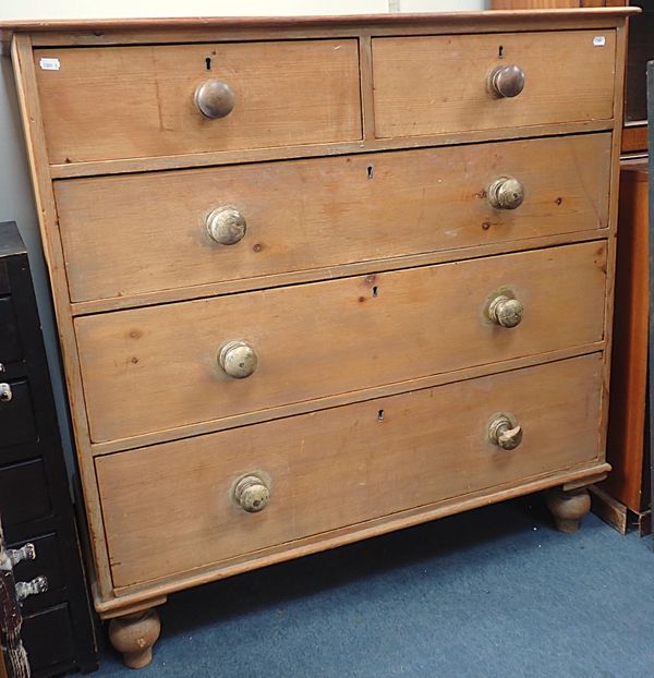 A VICTORIAN STRIPPED PINE CHEST OF DRAWERS