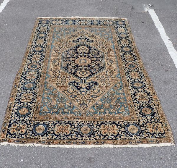 A BLUE GROUND PERSIAN  RUG
