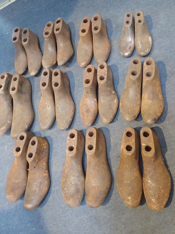 ELEVEN PAIRS OF IRON SHOE LASTS