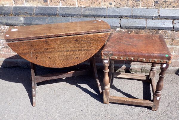 A 17th CENTURY OAK STOOL WITH LEATHER TOP
