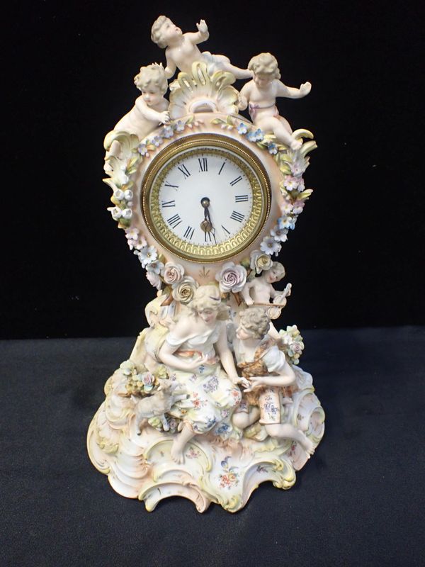 A GERMAN PORCELAIN MANTEL CLOCK CASE