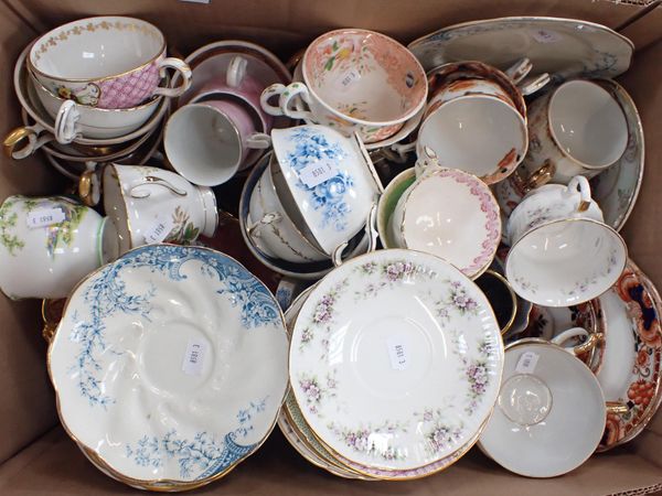 A COLLECTION OF CUPS AND SAUCERS