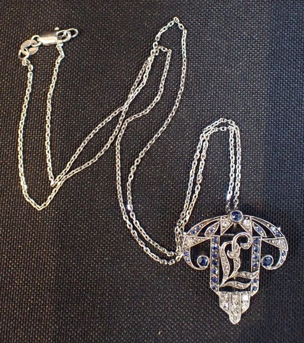 AN EDWARDIAN PLATINUM , DIAMOND AND SAPPHIRE PENDANT