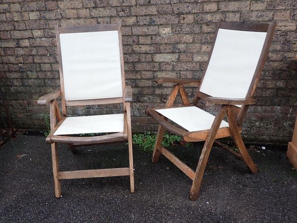 A PAIR OF 'ROYAL CRAFT' TEAK GARDEN CHAIRS