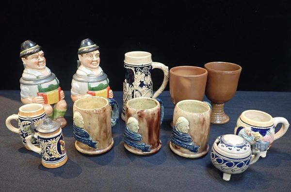 A PAIR OF MERKELBACH GERMAN POTTERY NOVELTY STEINS