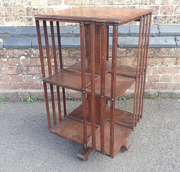 AN OAK REVOLVING BOOKCASE