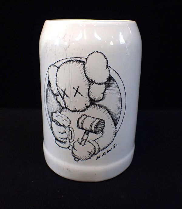 'KAWS..' (AMERICAN B.1974: A LIMITED EDITION BEER MUG