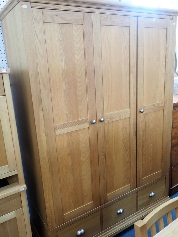A MODERN OAK TRIPLE WARDROBE