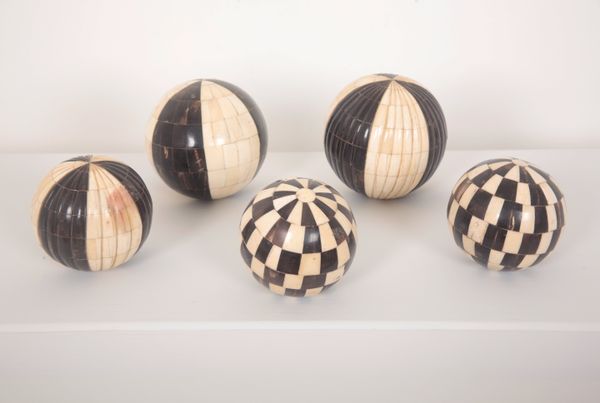 FIVE DECORATIVE SPHERES OR CARPET WEIGHTS VENEERED IN HORN