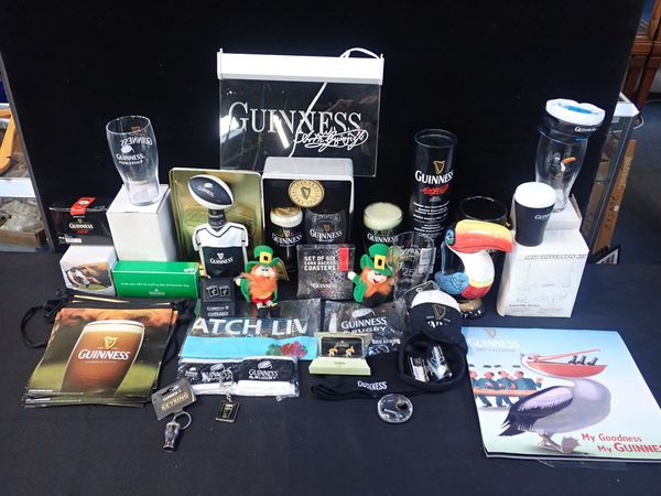 A COLLECTION OF GUINNESS THEMED MERCHANDISE AND SOUVENIRS