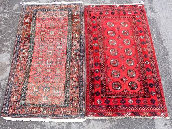 A RED GROUND PAKISTAN BOKHARA RUG
