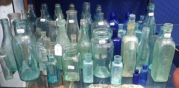 A COLLECTION OF VINTAGE GLASS BOTTLES