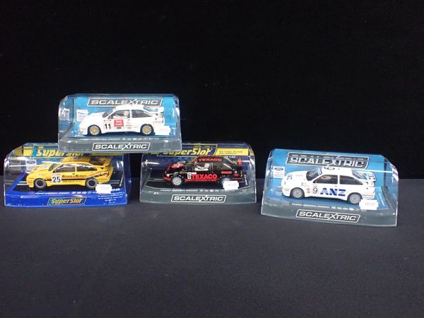 FOUR BOXED SCALEXTRIC 'FORD SIERRA RS500' CARS