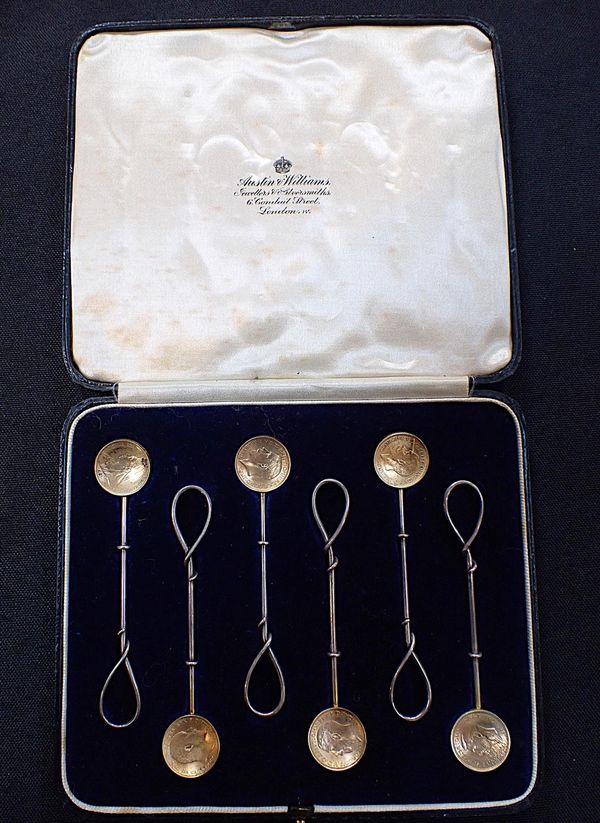 A SET OF COFFEE SPOONS WITH MAUNDY MONEY FOURPENCE BOWLS