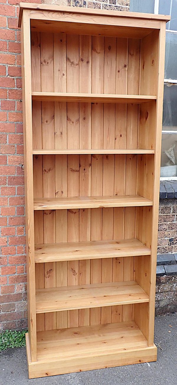 A TALL PINE BOOKCASE