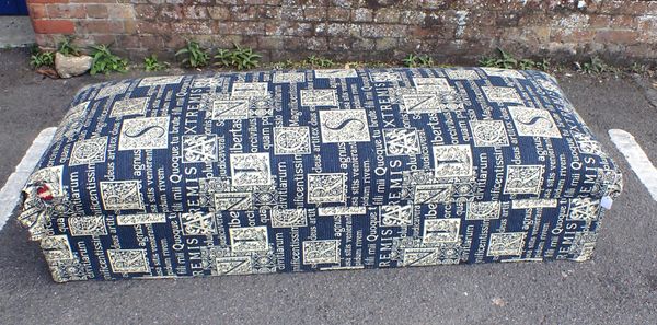 AN UPHOLSTERED BOX OTTOMAN