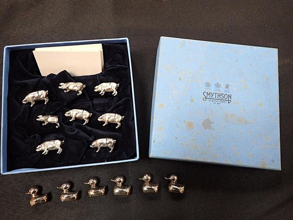 SMYTHSON OF BOND STREET: A SET OF EIGHT PIG PLACE CARD HOLDERS