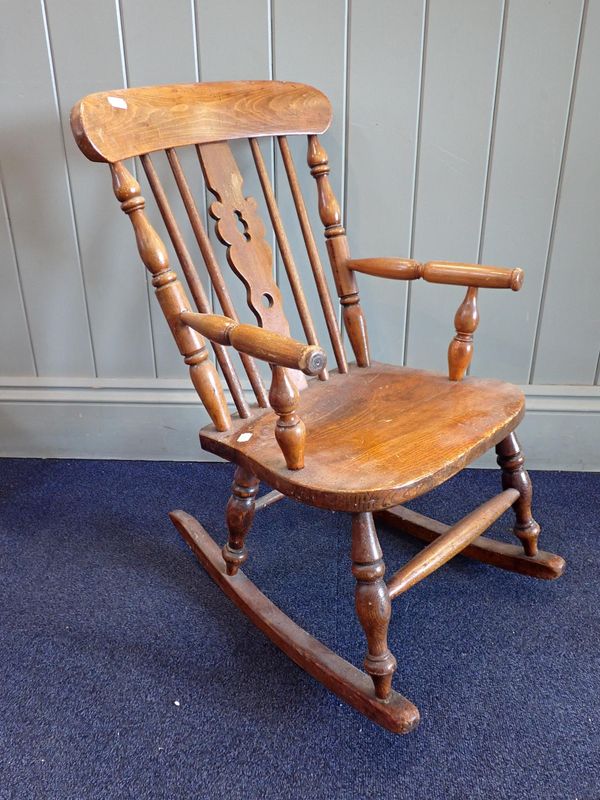 A VICTORIAN CHILDS' WINDSOR ROCKING CHAIR