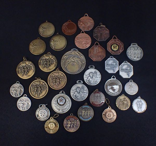 A COLLECTION OF RUNNING MEDALS