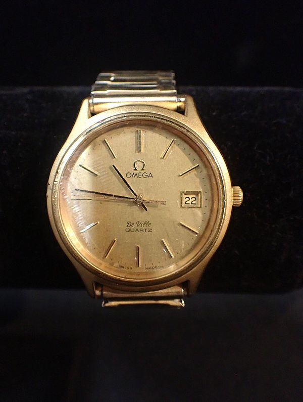 AN OMEGA DEVILLE GOLD PLATED WRIST WATCH